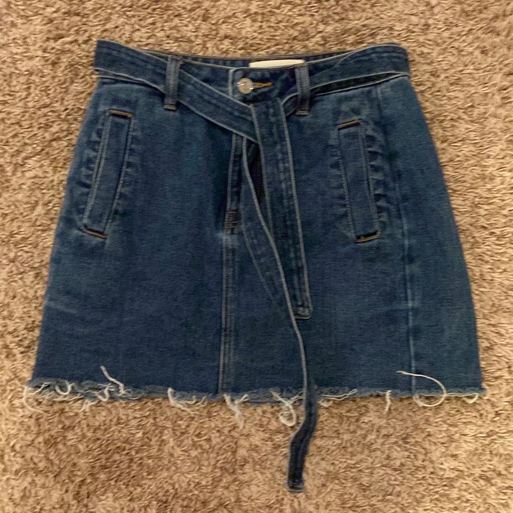 24 inch waist (can fit a 26) jean skirt with adjustable toes, pacsun